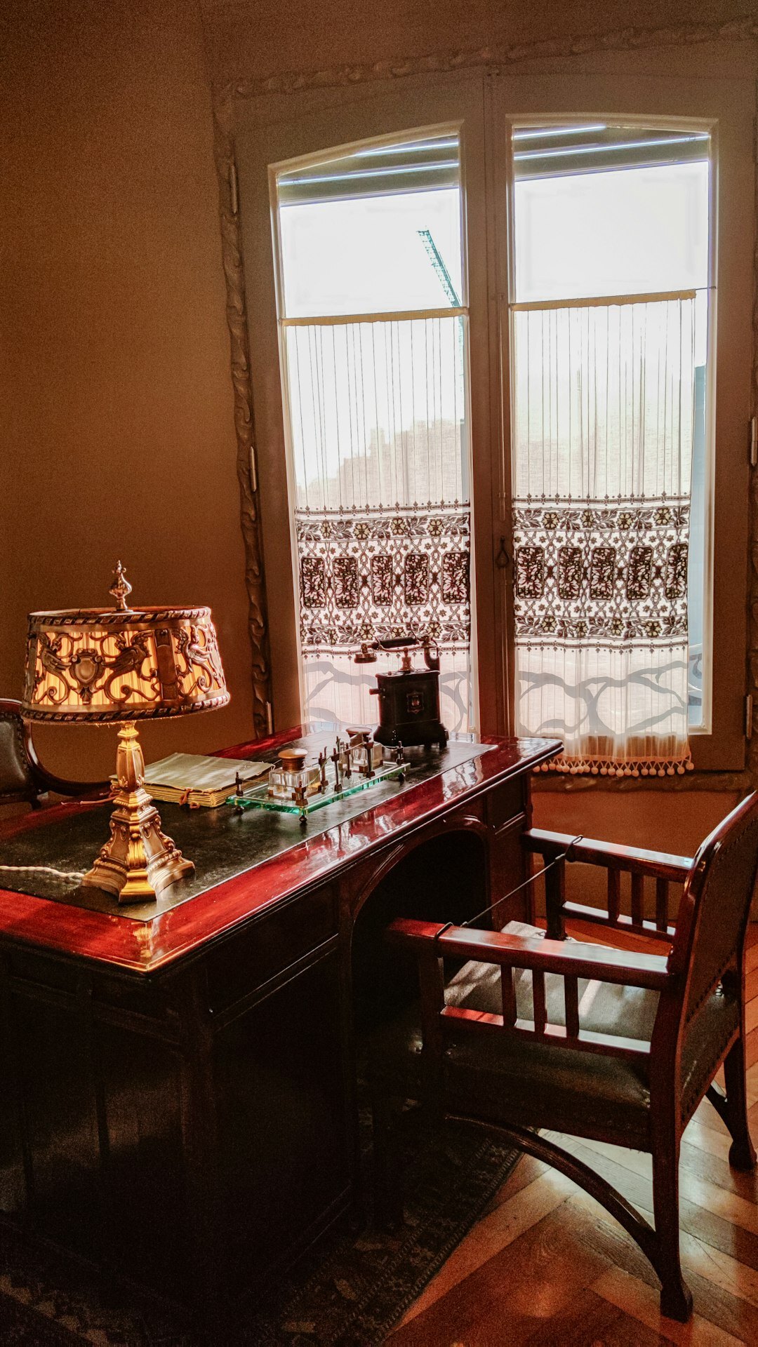 Founder examining a timepiece in a private atelier office