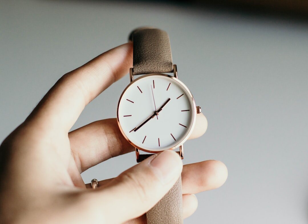 person trying on luxury watch