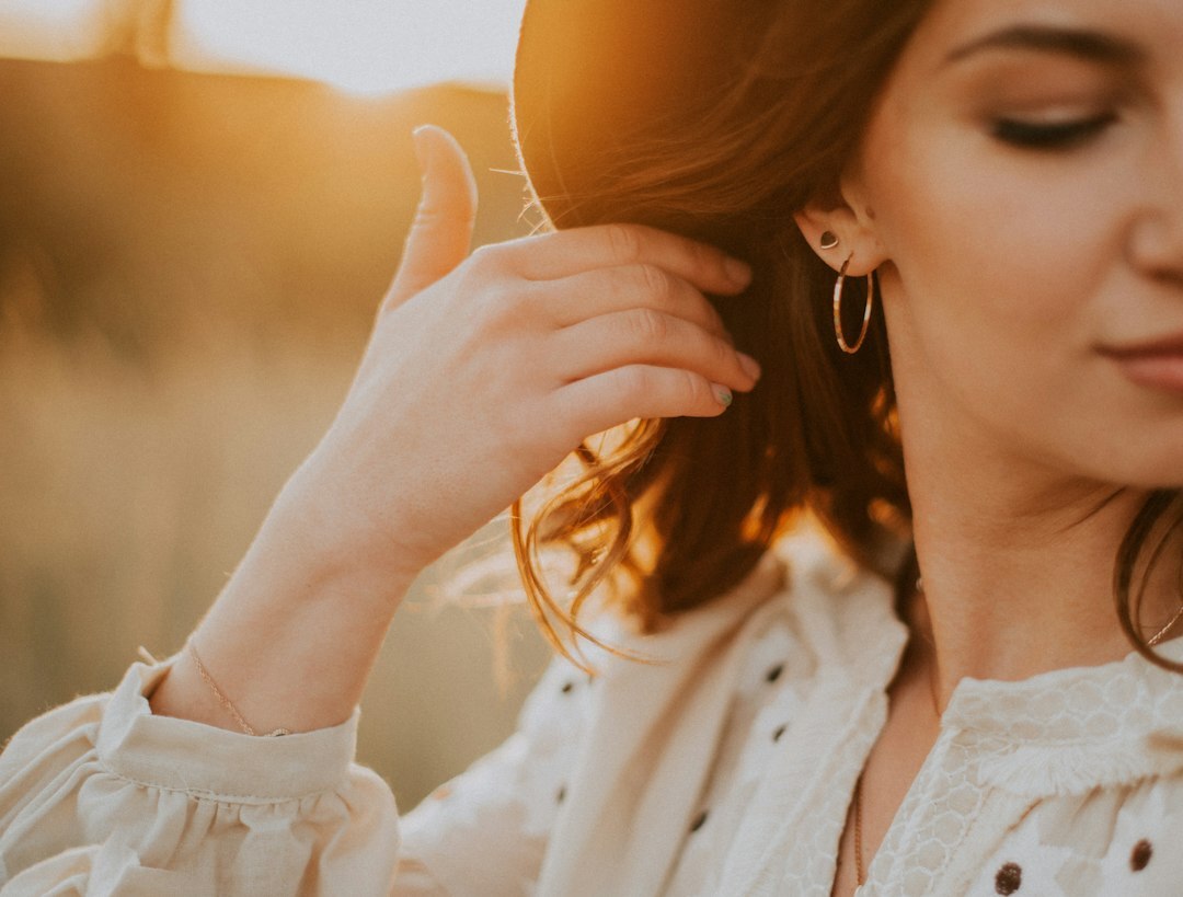 woman wearing luxury earrings